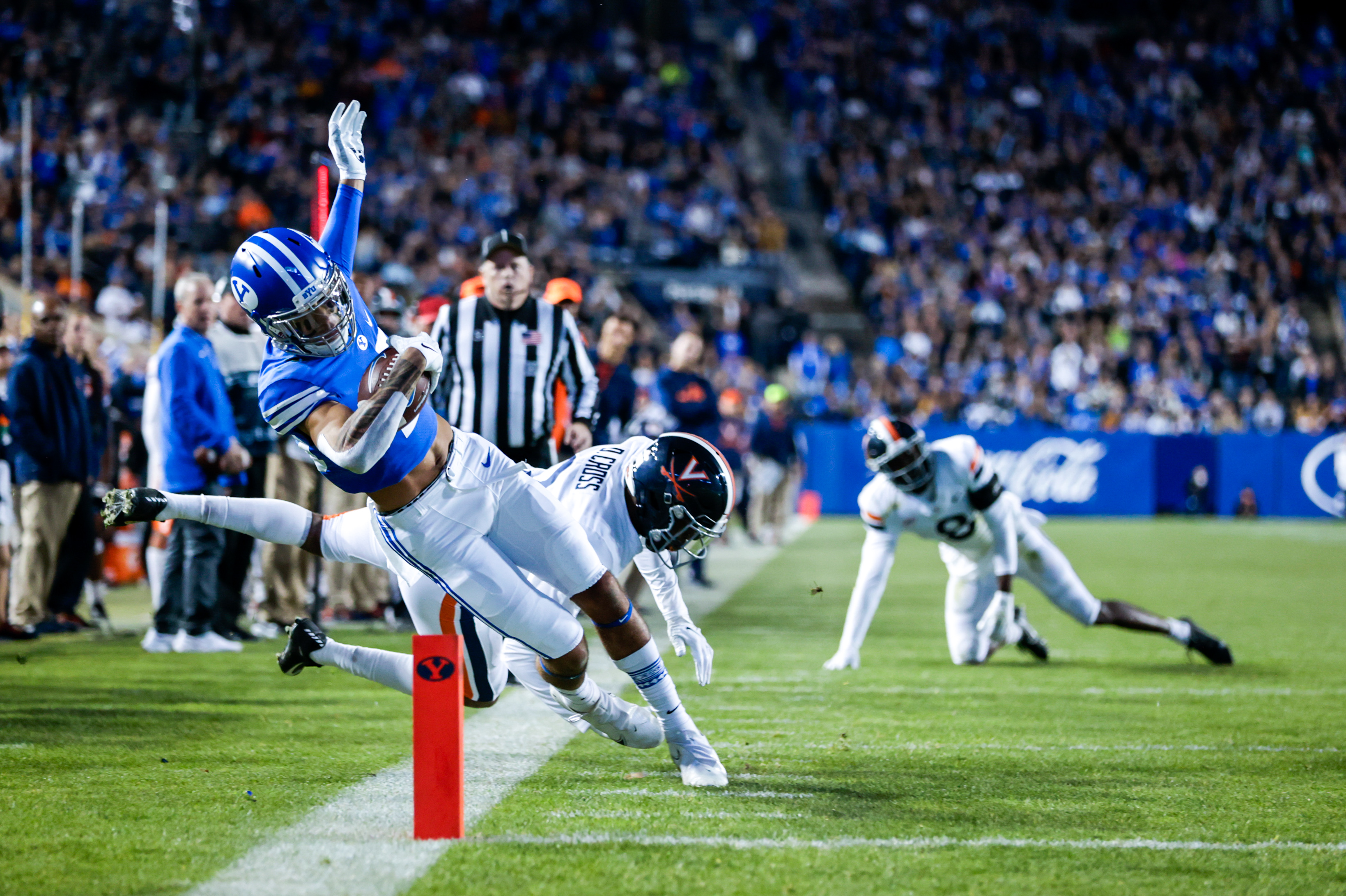 BYU wide receiver Samson Nacua scores a touchdown in the BYU 66-49 victory over Virginia.