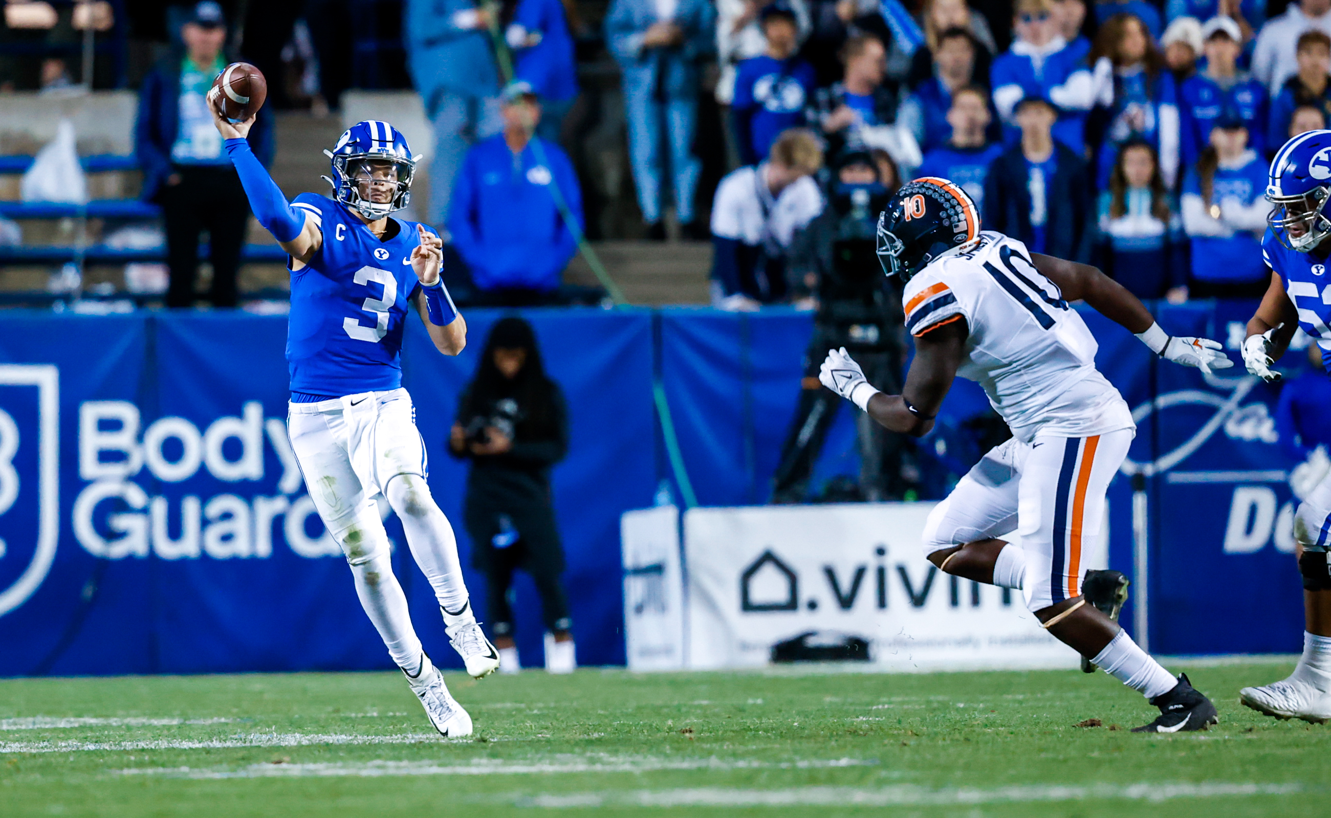 BYU quarterback Jaren Hall throws a pass during the 66-49 BYU victory over the Virginia Cavaliers.