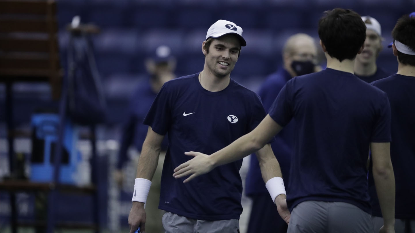 Sam Tullis high fives teammate vs. Weber State