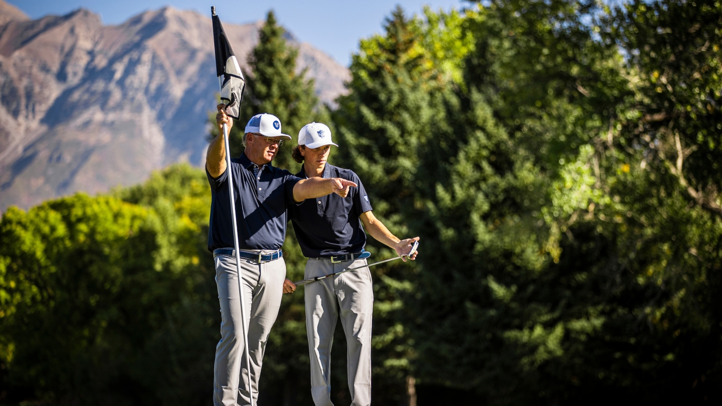 BYU head coach Bruce Brockbank coaches Cole Ponich