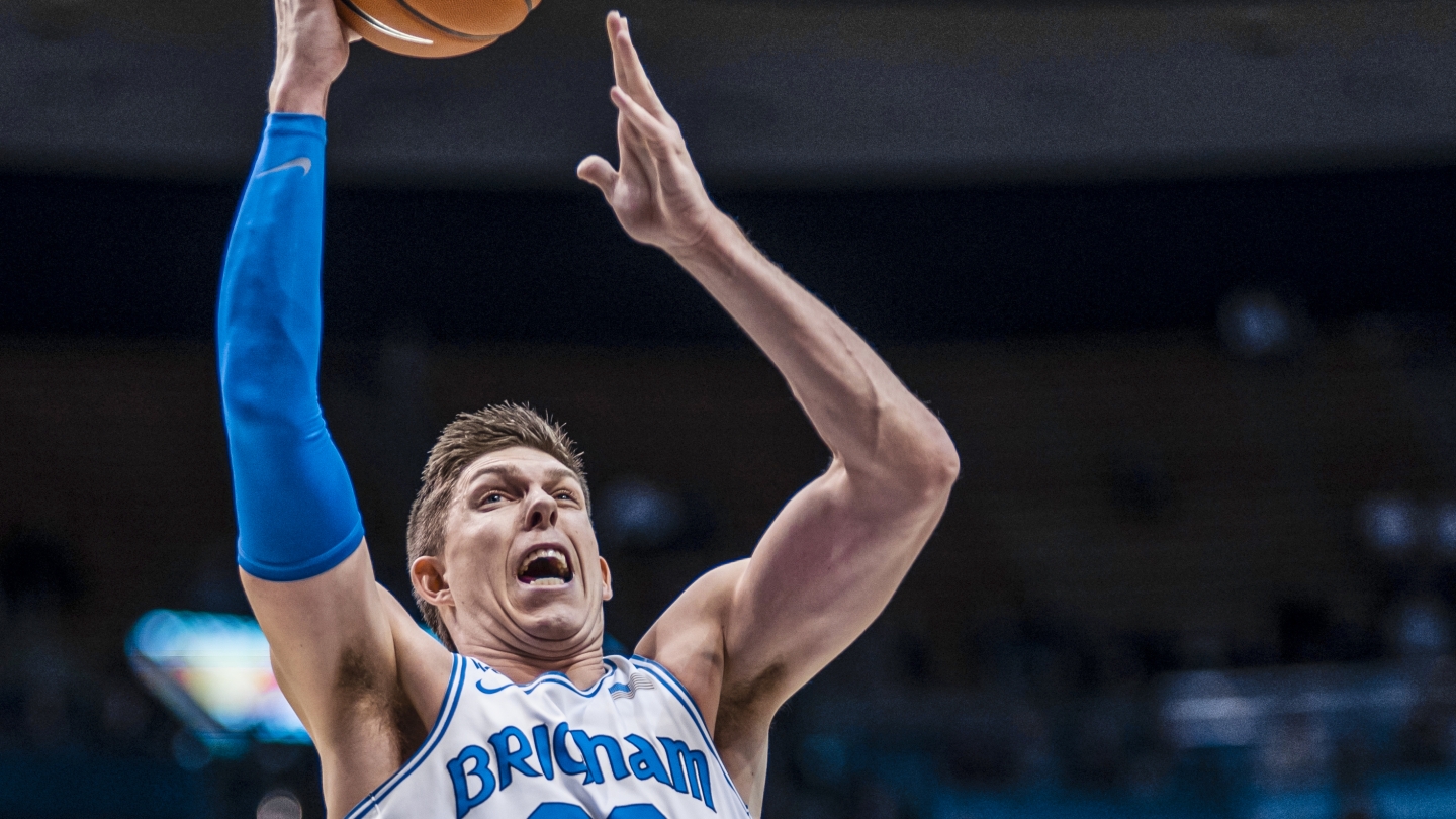 Dalton Nixon moves towards the basketball for a right-handed layup