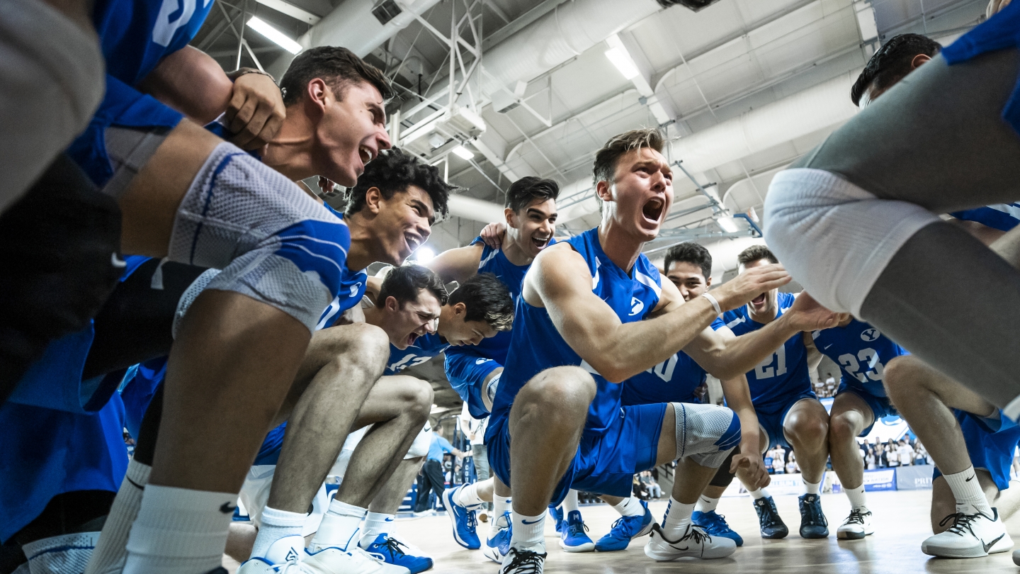 Brody Earnest leads a cheer in the middle of the BYU men's volleyball huddle
