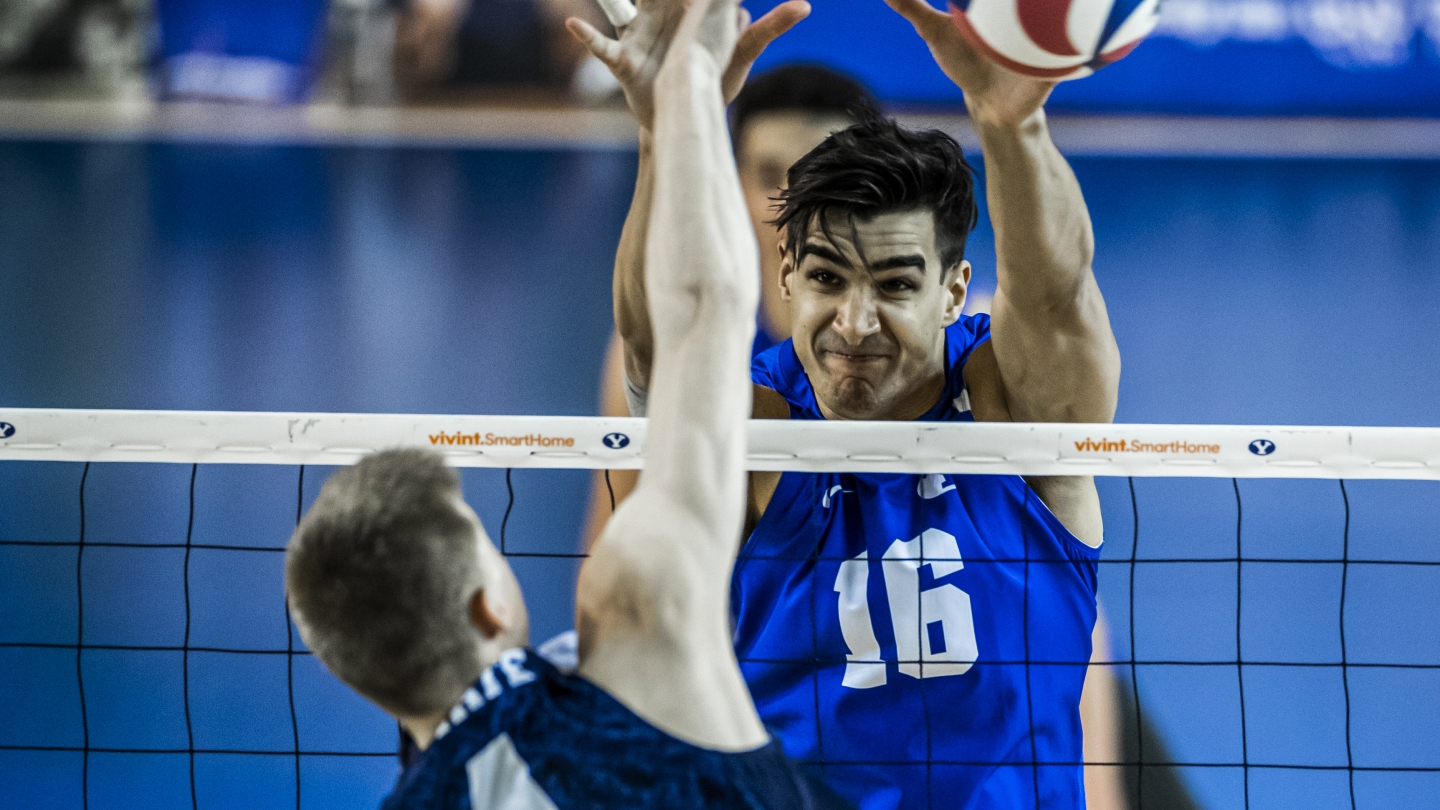 Felipe de Brito Ferreira blocks an attack for BYU men's volleyball against Penn State