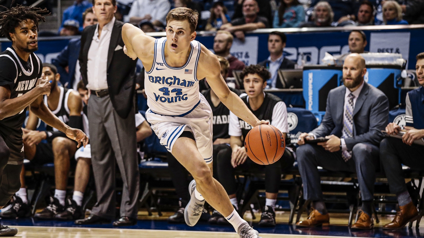 Connor Harding holds off a Nevada defender as he drives to the basket.