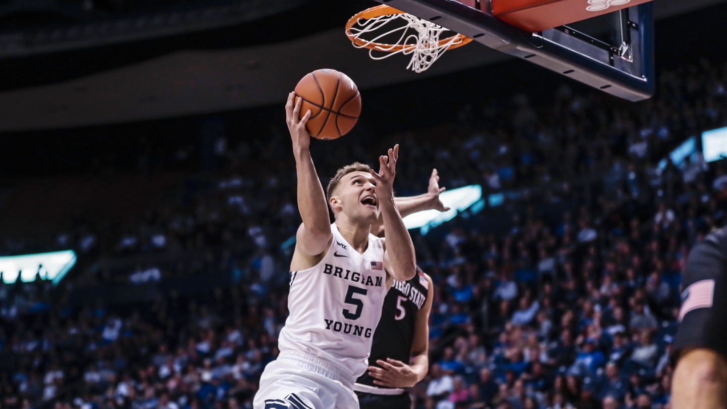 Jake Toolson scores on a reverse layup versus San Diego State.